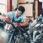 Mechanic repairing a motorcycle