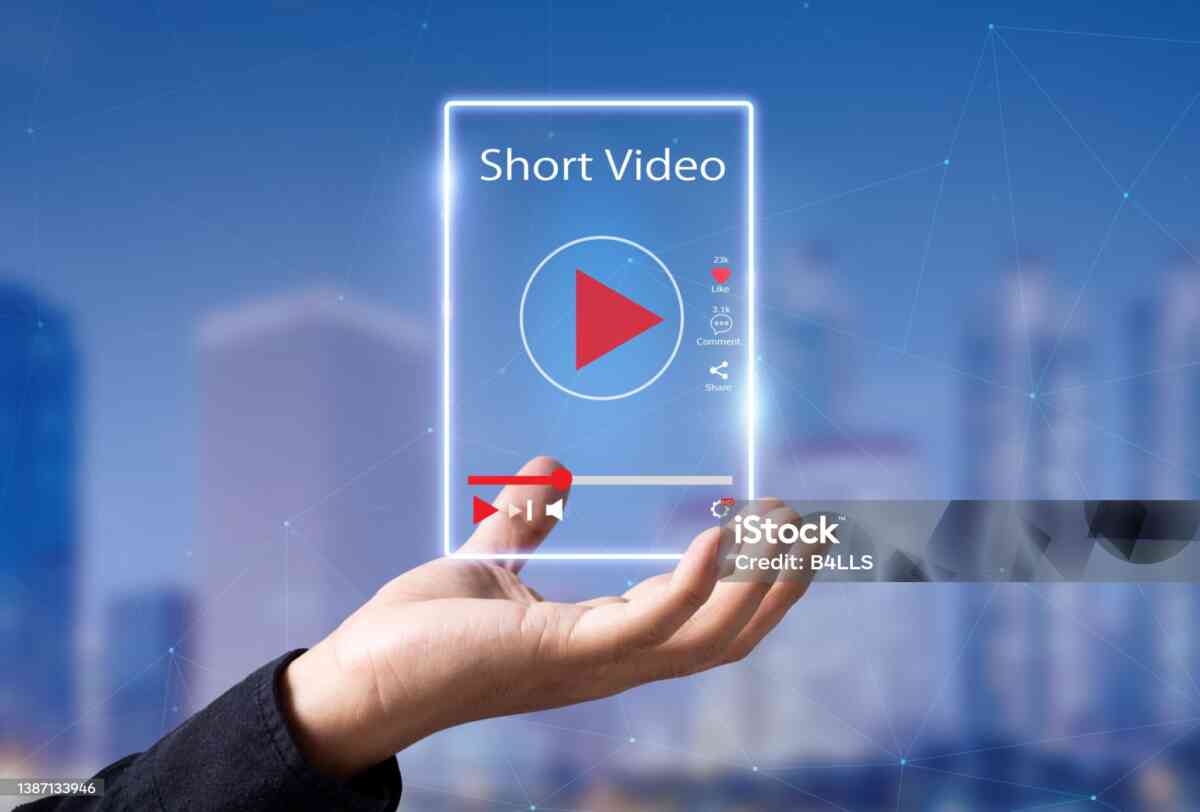 Man hands holding virtual short video player with blurred city as background
