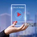 Man hands holding virtual short video player with blurred city as background
