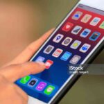 Video icon on mobile screen, video sharing and marketing