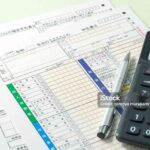 Japanese Income Tax Return Form with Calculator and Pen