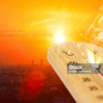 summer hot weather season high temperature thermometer with city view.