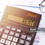 Calculator with the word RENT on the display