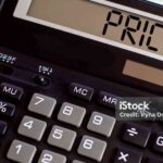 Calculator with the word PRICE on the display