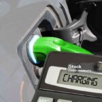 An electric car, calculator and cost of charging from the battery