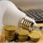 Cost of electric utilities with light bulb for payment.