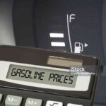 A car, fuel gauge and calculator for petrol price