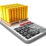 Golden Bars over Calculator on a white background. 3d Rendering