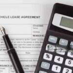 Lease motor vehicle Document Agreement with fountain Pen and calculator
