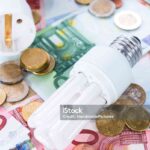 Light Bulbs on european banknotes (close-up shot)