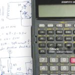 Scientific calculator on electronics notes. Invention concept