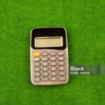 Calculator placed in green grass