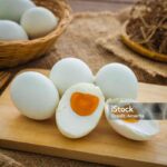 Salted duck eggs on wooden board