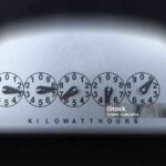 OLDER STYLE KILOWATT HOUR ELECTRIC METER REGISTER DIALS on black background